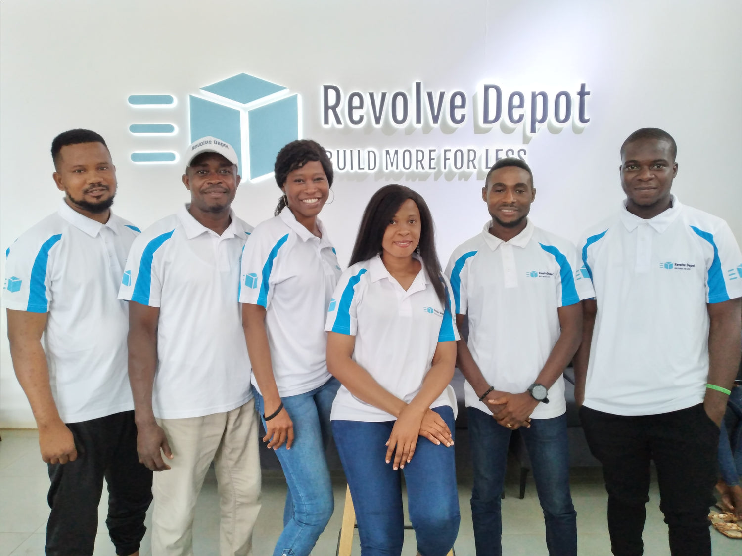 Team members of Builders Merchant Owerri, proudly standing with Owerri construction supplies, exemplifying quality and commitment in the builders merchant sector in Nigeria.